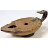 An early 20thC B & V B Roman style oil lamp, of compressed circular outline with shaped spout and