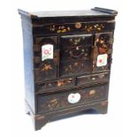 A Japanese Meiji period ebonised wooden jewellery casket, designed as a chest of drawers with gilt