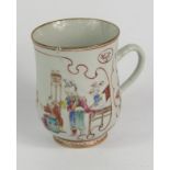 A Qing Dynasty porcelain famille rose tankard, of baluster form decorated with panels of figures and