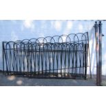 A cast iron gate, gate posts and fencing, approx 770cm long.