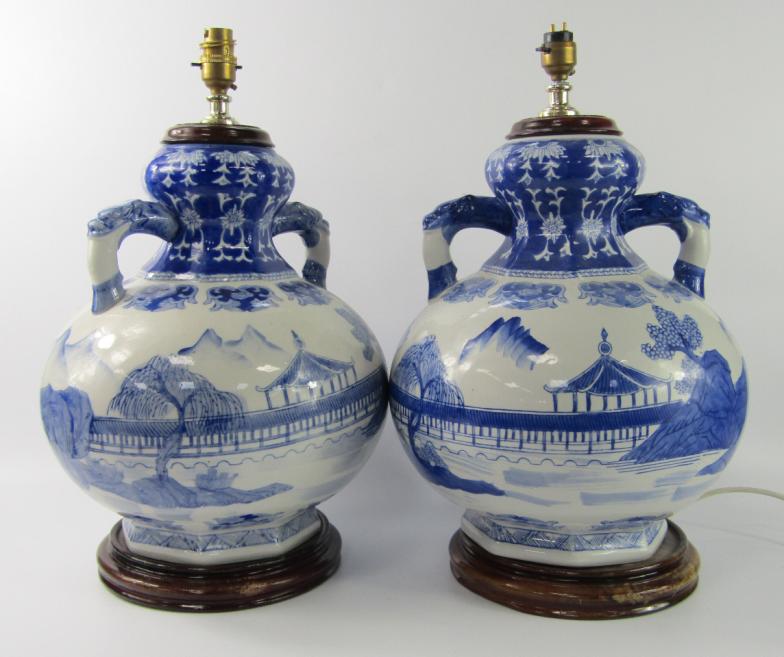 A pair of modern Chinese porcelain table lamps, of twin handled baluster form decorated in blue