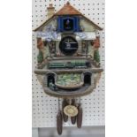 A Flying Scotsman battery operated cuckoo clock, 57cm high.