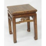 A Chinese hardwood urn stand, of square section, raised on square legs united by stretchers