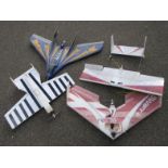 Four various polystyrene remote controlled planes.