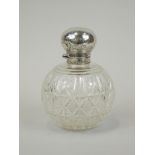 A late Victorian cut glass scent bottle, with silver mount, bearing monogram, London 1899, 10cm