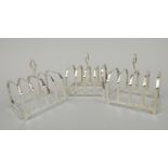 A pair of George V silver four division toast racks, of angular form, Birmingham 1928, and another