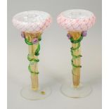 A pair of Australian Heaney glass candlesticks, each with a opaque pink drip pan, the stem decorated