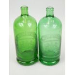 Two green glass bottles, with etched decoration for C Mumby & Co Portsmouth, made in France, 24cm