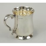 An Elizabeth II silver tankard, in mid 18thC style, with concave sides and a domed foot, Sheffield