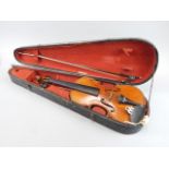 A late 19thC / early 20thC violin, with two piece back, length of back 36cm, two violin bows, and an