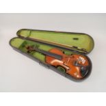 A 20thC violin, with a two piece back, later painted, length of back 35cm, and a bow, stamped P &