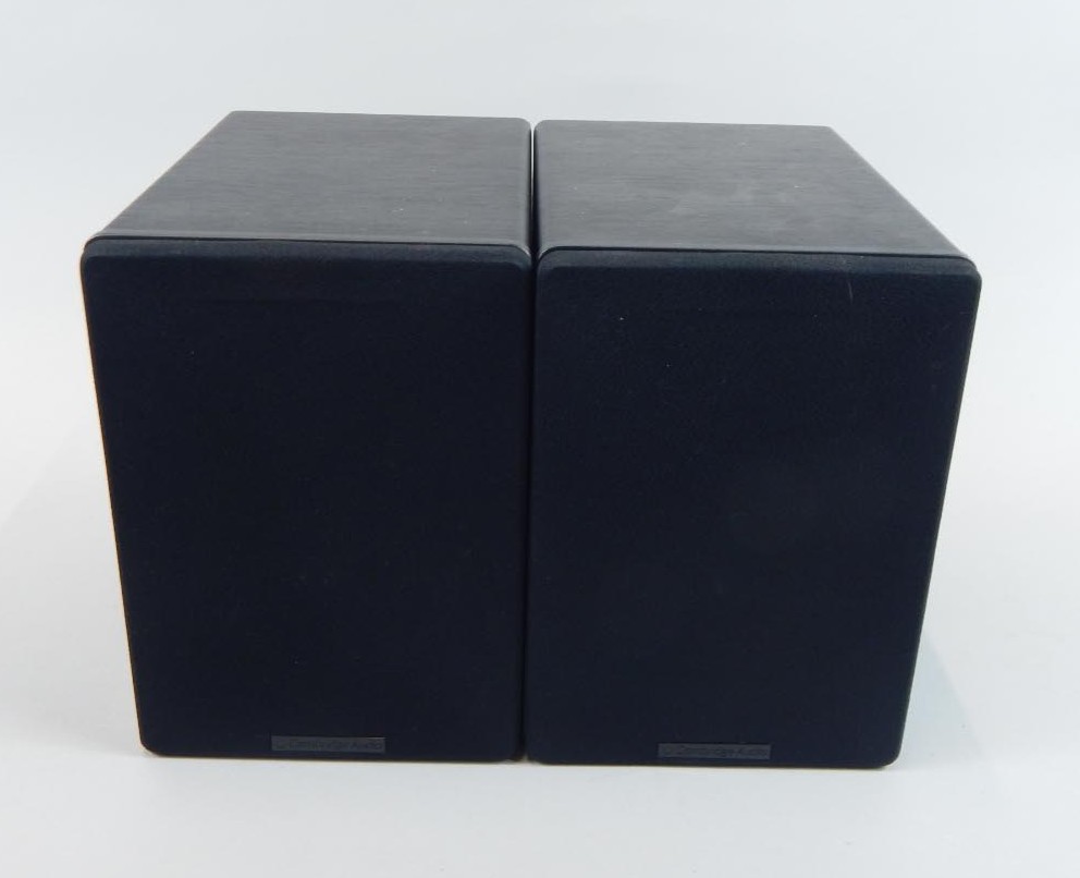 A pair of Cambridge audio speakers, in simulated wood casing.