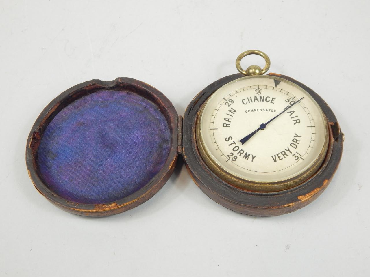 A 20thC pocket barometer, the 4cm dial marked Rain, Change, Fair, Stormy and Very Dry, with an