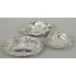 Three various late 19thC / early 20thC pierced silver bonbon dishes, each embossed with scrolls,