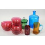 A collection of coloured glass, to include six cranberry tinted figure bowls, ruby tinted beaker,