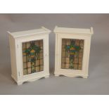 A pair of painted cabinets, each with a stained glass leaded panels, on bracket feet, 59cm high,