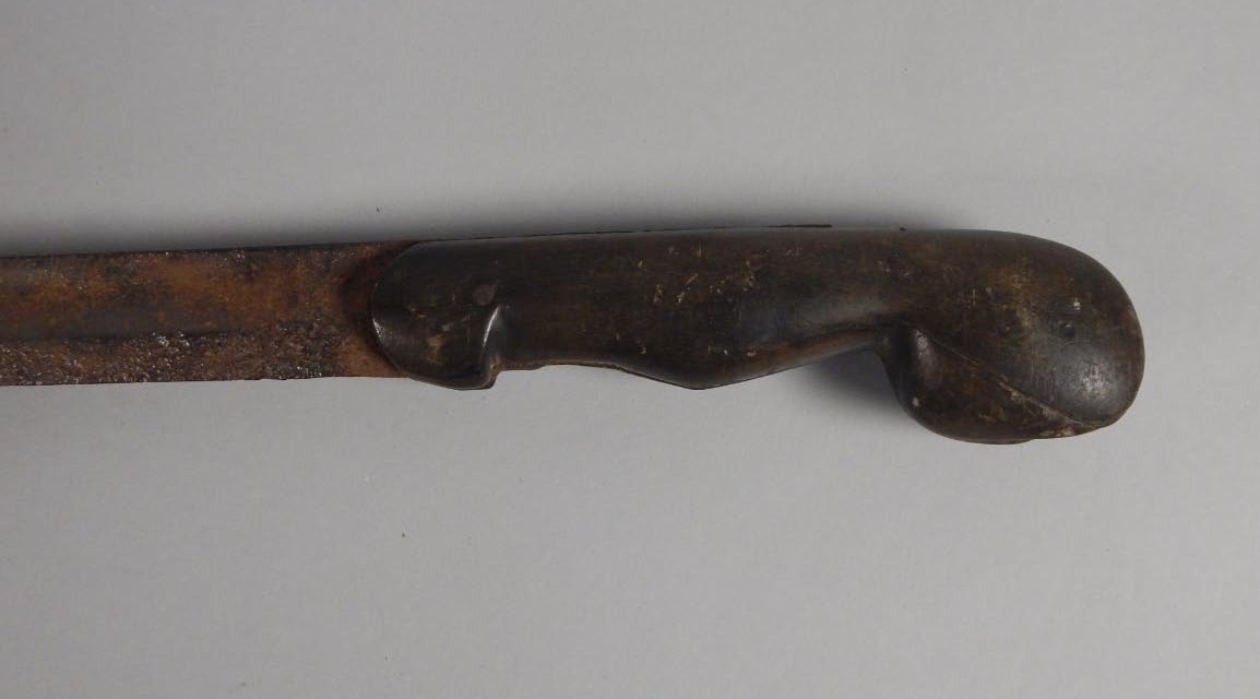 A late 19thC/early 20thC African sword, with an iron blade, the handle possibly shaped from rhino - Image 2 of 3