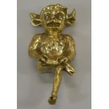 A large 19th/early 20thC Lincoln imp doorstop or advertising figure, with a loop to the head, 24cm