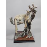 After Giuseppe Armani. Silent watch, a puma in a tree, a Florence moulded porcelain figure,