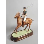 A Royal Worcester porcelain figure, of the Duke of Edinburgh playing polo, modelled by Doris Lidner,