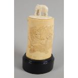 An early 20thC Japanese box and cover, the lid carved in the form of an elephant, the base carved