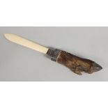 An unusual taxidermy related paper opener, formed from a warthog hoof, with an ivory blade,