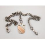 A silver watch chain and shield fob, 64g all in.
