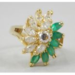 A ladies dress ring, with green marquise stones and diamond set, abstract design, stamped 18K, 8.