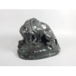 After Barye (1796-1875). A 19thC French bronze group of Lion au Serpent, with brown and green