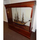 A scale model of HMS Victory, the flagship of Admiral Lord Nelson, in a mahogany case with glass