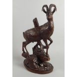 A late 19thC/early 20thC Black Forest linden wood carving, in the form of a Mountain Goat or Chamois