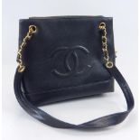 A Chanel black ladies handbag, with gilt metal mounts and shoulder strap, sold with certificate,