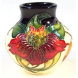 A modern Moorcroft Anna Lilly, printed and impressed marks beneath, 10cm high. (boxed)