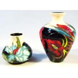 A modern Moorcroft Satin Flower pattern vase, printed marks beneath, 12cm high, and another vase. (