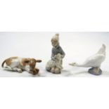 A Lladro figure, of a recumbent cow, no. 120, 18cm wide, Nao goose no. 555, a Lladro farmer girl