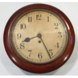 An early 20thC mahogany cased wall clock, the 25cm dia. Arabic dial revealing a key wind movement,