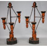 A pair of modern hardwood and metal freestanding garden chandelier sculptures, each with partially