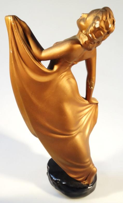 A mid-20thC plaster figure, of a lady in flowing robes, painted in gold colours on black ground, - Image 2 of 3