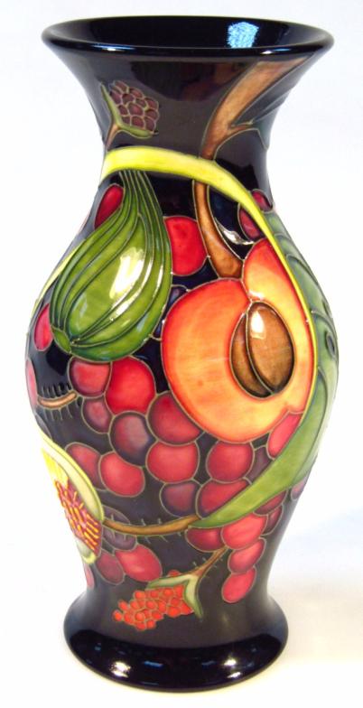 A modern Moorcroft Queens Choice vase, printed and impressed marks beneath, 22cm high. (boxed)