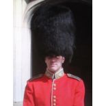 A late 19thC/early 20thC bearskin hat former property of Lord Hesketh, with tin, set with Edward