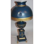 A modern toleware style metal cased table lamp, of classical design, the domed part pierced shade
