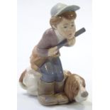 A Lladro figure, Muneco Cazador no. 4971, printed marks beneath, 20cm high. (boxed)