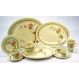 A 1930's Clarice Cliff late Art Deco Corolla pattern part service, comprising three graduated meat