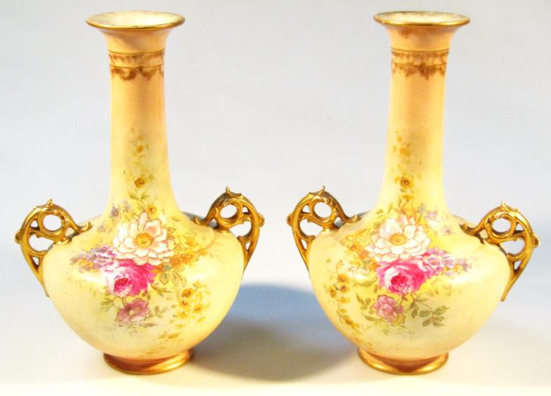 A pair of Edwardian vases, each bellied circular body transfer printed with flowers, the trumpet