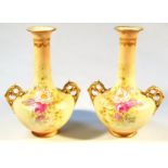A pair of Edwardian vases, each bellied circular body transfer printed with flowers, the trumpet
