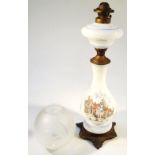 A Victorian milk glass and overlay lamp, the bulbous body transfer printed with a scene of figure