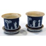 A pair of 19thC Wedgwood dark blue Jasperware jardinieres, on stands, each of miniature compressed