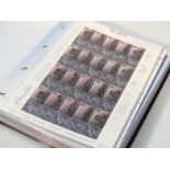A Royal Mail Smiler's album containing a quantity of GB stamps, unperforated sets, Dennis The