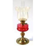 A Victorian oil lamp, with clear glass funnel and frosted Art Nouveau floral glass shade with