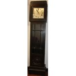 A 1920's stained oak longcase clock, the 25cm silver dial with Roman numerals, revealing a key wound